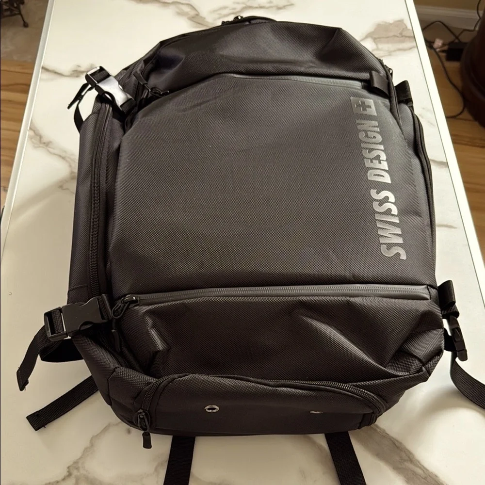 NEW* Men's Swiss Design Black Travel Backpack.  7 seperate storage compartments.